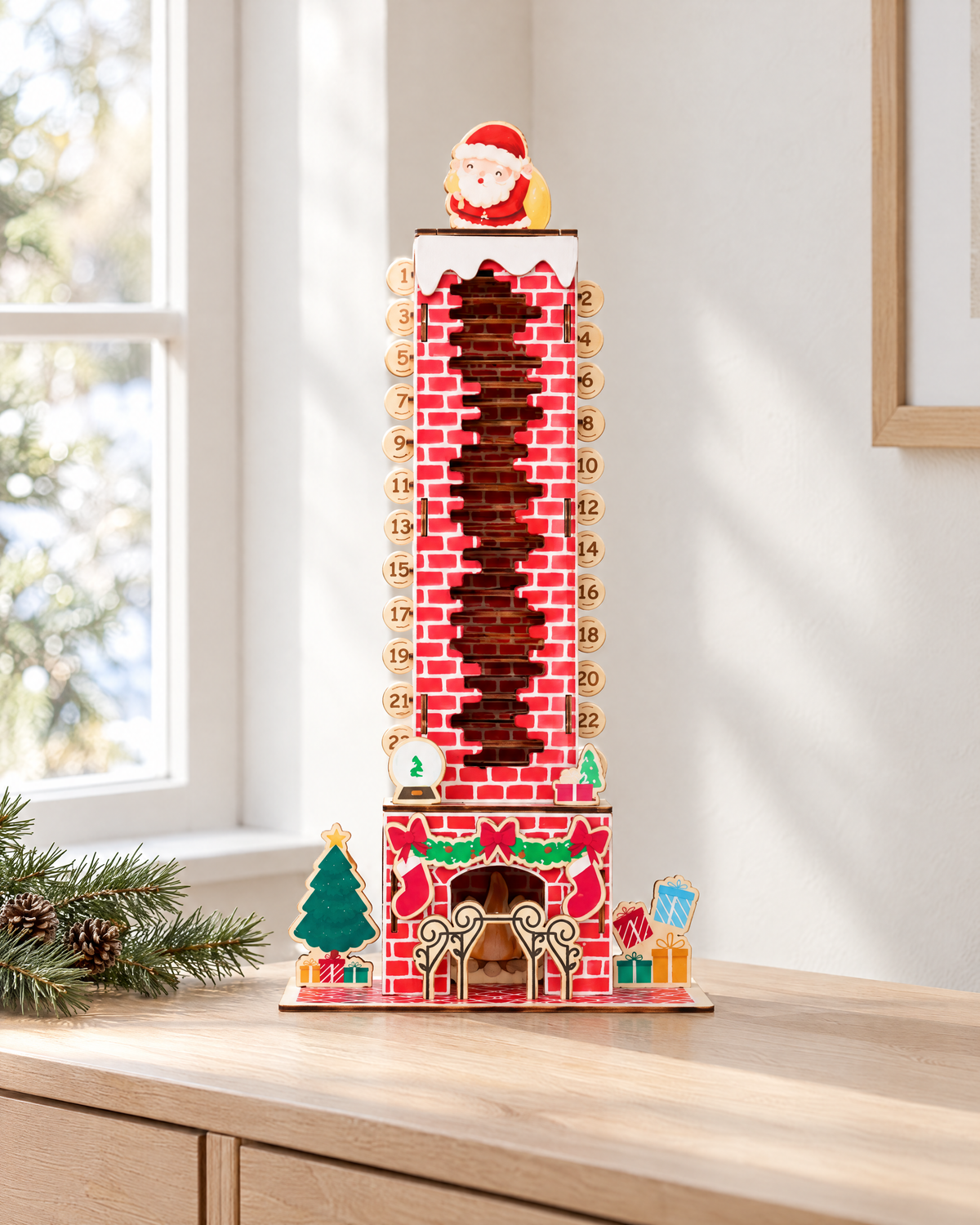Wooden fireplace advent calendar with Santa on top, shown on a console table by a window