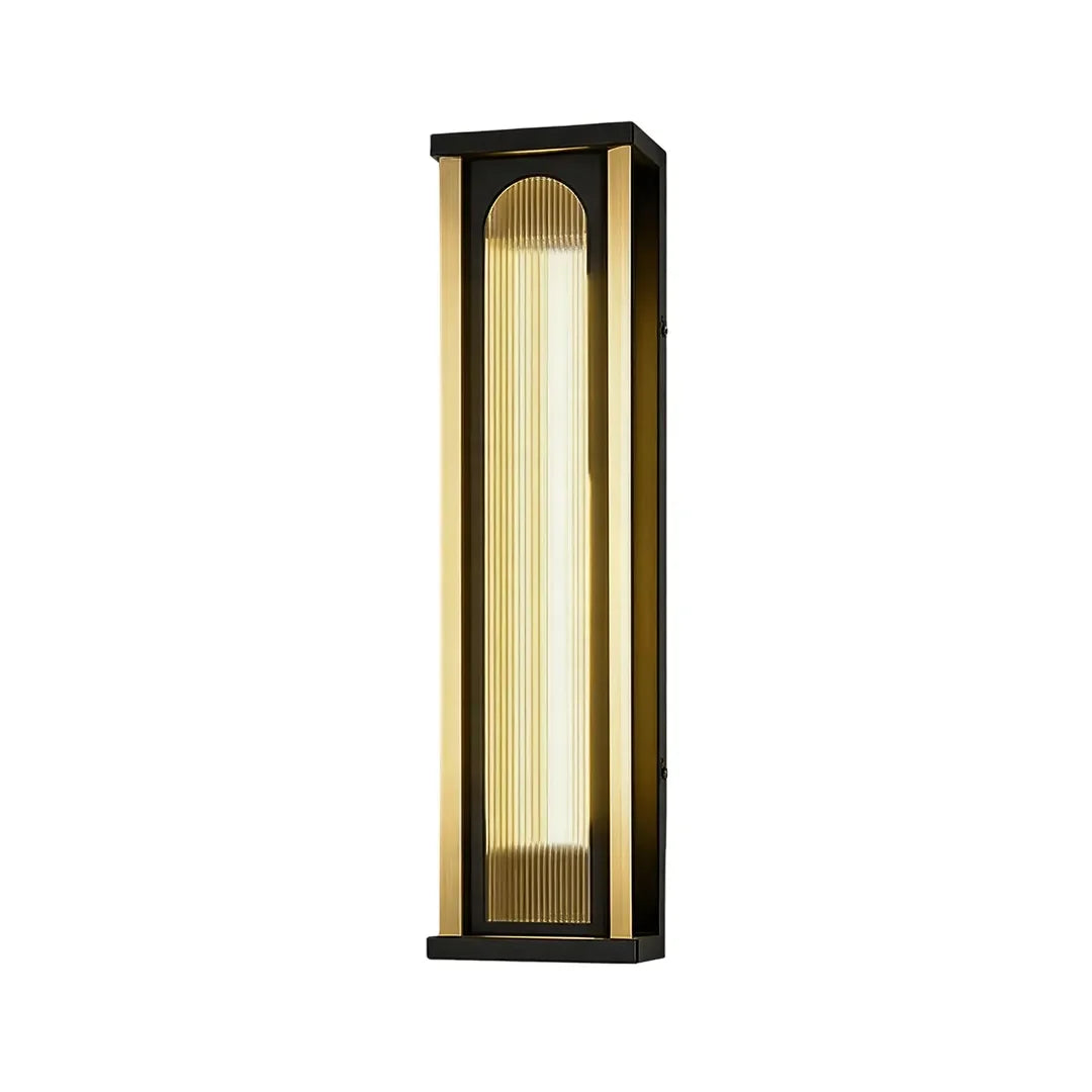 Tall outdoor wall sconce with black metal frame and vertical ribbed glass