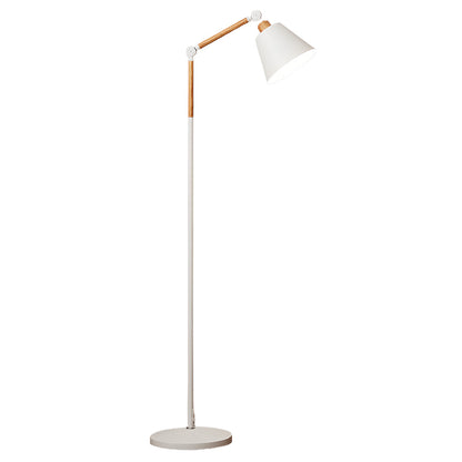 Elegant metallic floor lamp with black directional shade and copper accents beside modern sofa