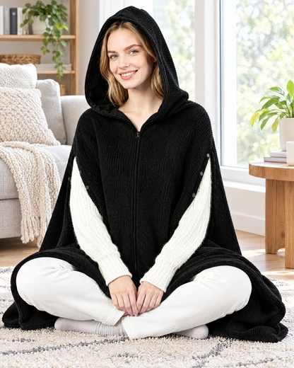 Woman wearing a black heated hooded wearable blanket shawl