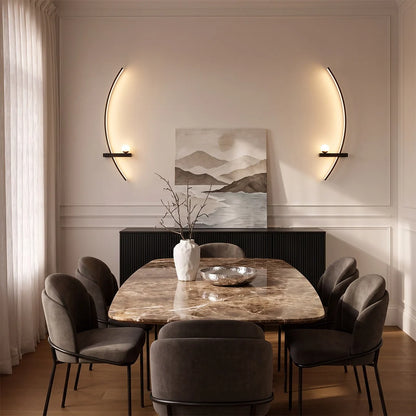LED curved wall lights mounted symmetrically above a dining console, adding sculptural warm lighting to a modern dining room.