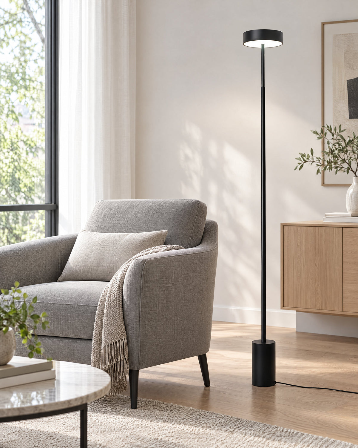 Dimmable floor lamp with a round disc head in a modern living room