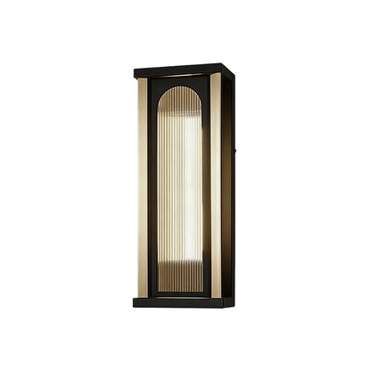 Medium outdoor wall sconce with black frame and warm ribbed glass shade