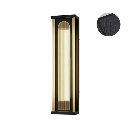 Medium solar wall sconce with black metal frame and vertical ribbed diffuser