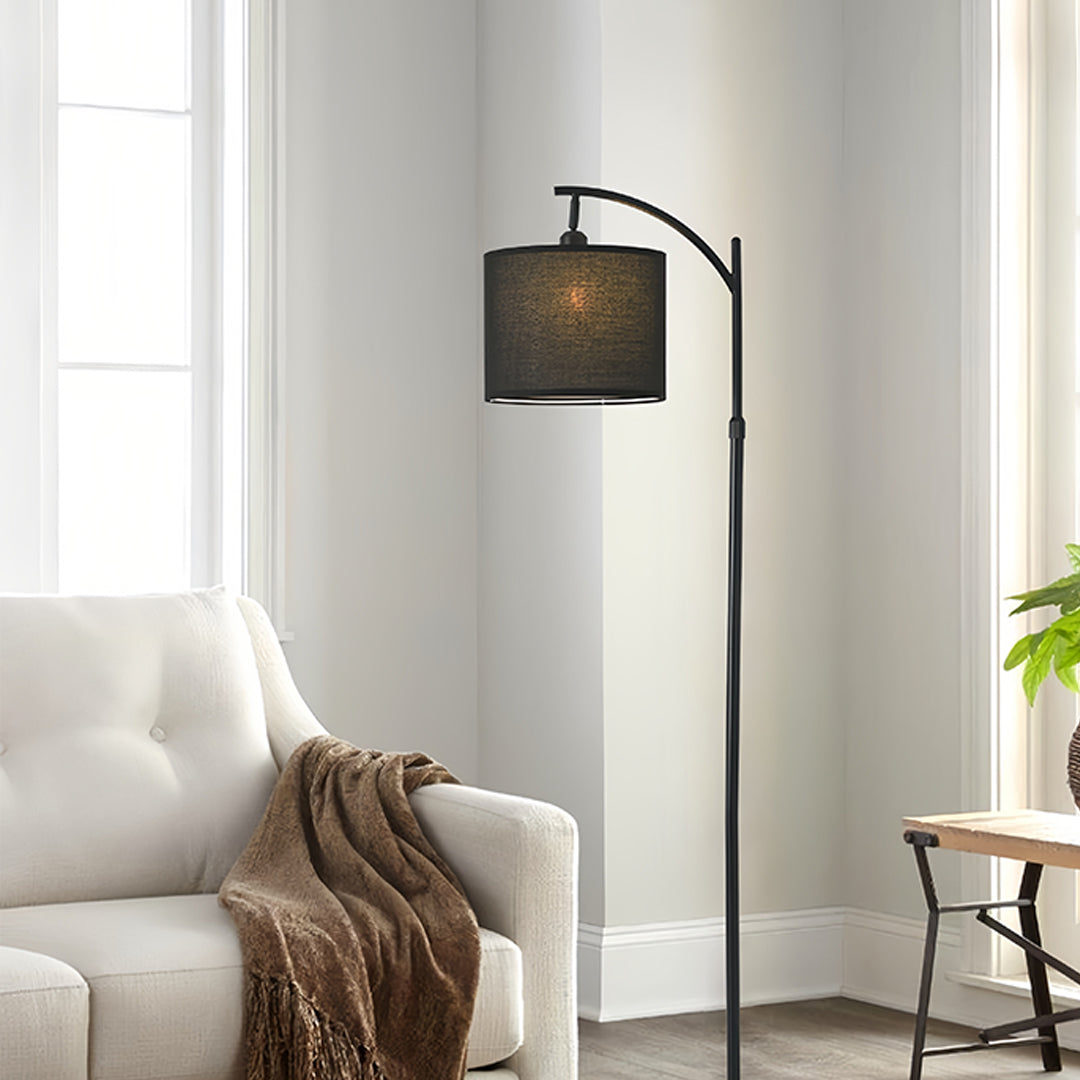 Contemporary seating area with small black pendant light providing warm ambient illumination through fabric shade