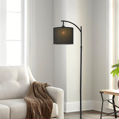 Contemporary seating area with small black pendant light providing warm ambient illumination through fabric shade