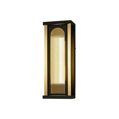 Short outdoor wall sconce with black frame ribbed glass and warm LED lighting