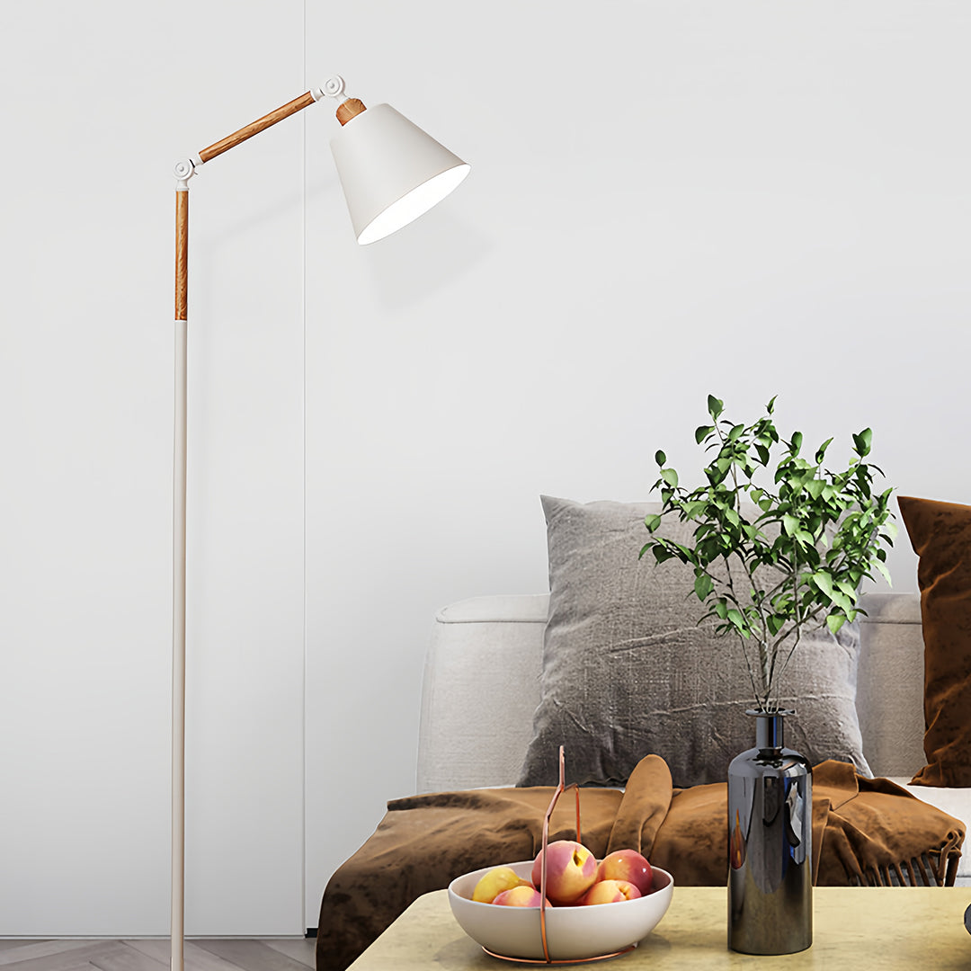 Stylish metallic floor lamp with adjustable white shade and brass finish in modern living room